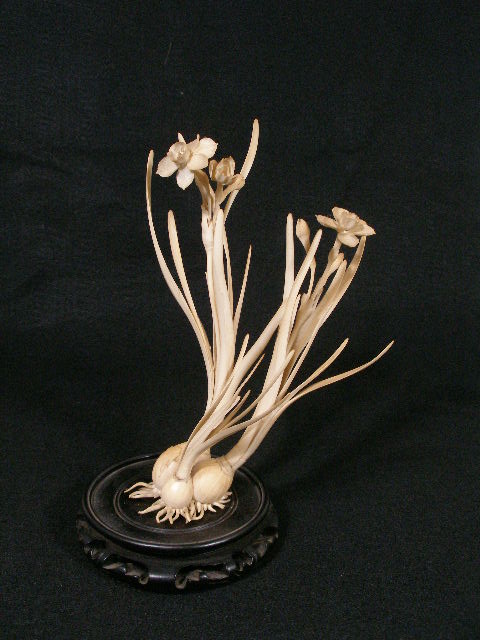 Appraisal: Ivory Floral Carving Chinese th c jonquils growing from their