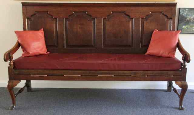 Appraisal: An th Century four-panel back settle with strung seat on