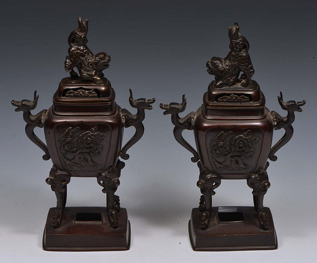 Appraisal: A PAIR OF JAPANESE BRONZE INCENSE BURNERS each with dog