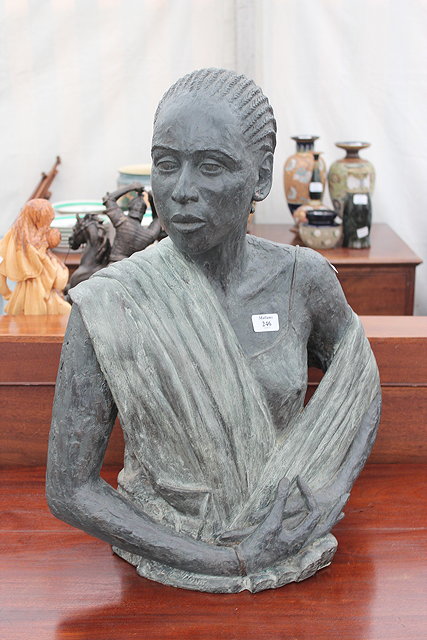 Appraisal: A BRONZED RESIN BUST of a lady in a shawl