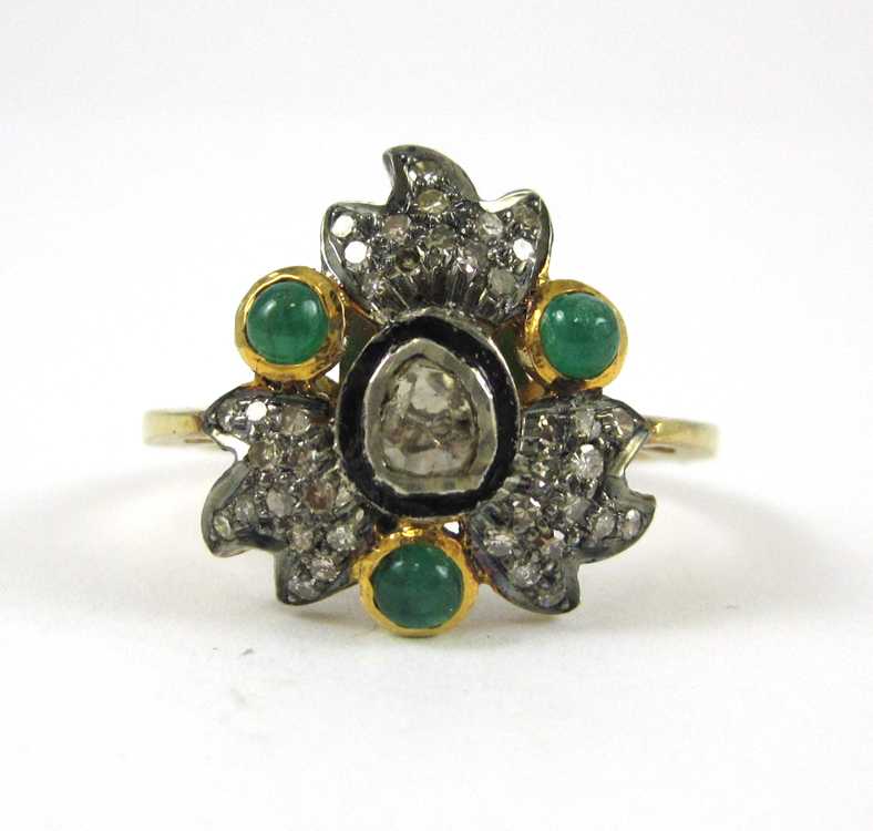 Appraisal: INDIA DIAMOND EMERALD SILVER AND GOLD RING The silver and