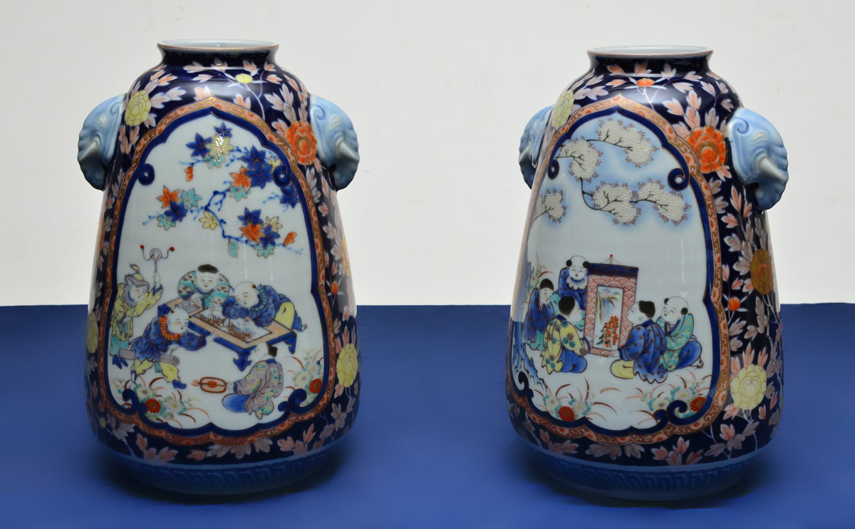 Appraisal: PAIR POLYCHROME ORIENTAL VASES Ovoid form with imari colors scenes