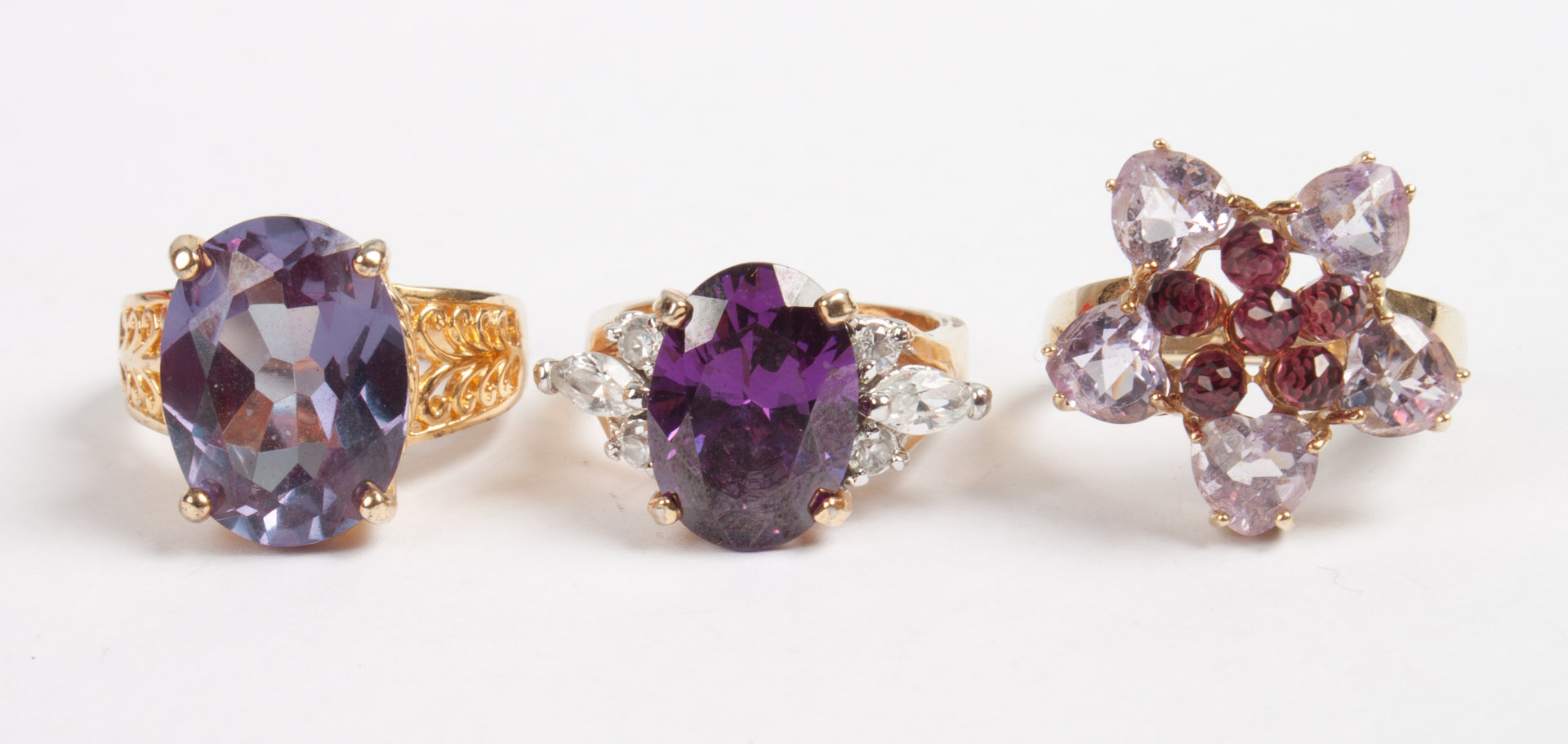 Appraisal: Three lady's amethyst rings K gold amethyst flower-form ring size