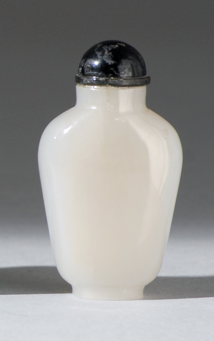 Appraisal: MINIATURE WHITE JADE SNUFF BOTTLE In elongated ovoid form Height