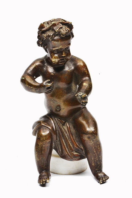 Appraisal: AN ANTIQUE BRONZE CHERUB seated on an alabaster base overall