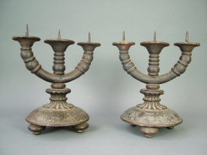 Appraisal: A pair of th century Continental cast iron pricket twin