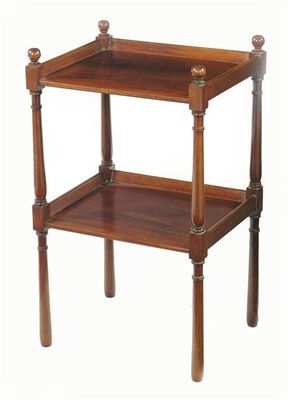 Appraisal: A mahogany two tier etagere with sloping galleries in cm