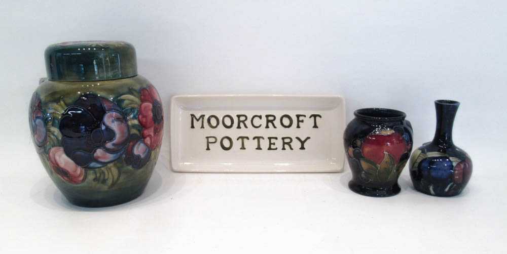 Appraisal: FOUR MOORCROFT POTTERY PIECES a lidded ginger jar in the