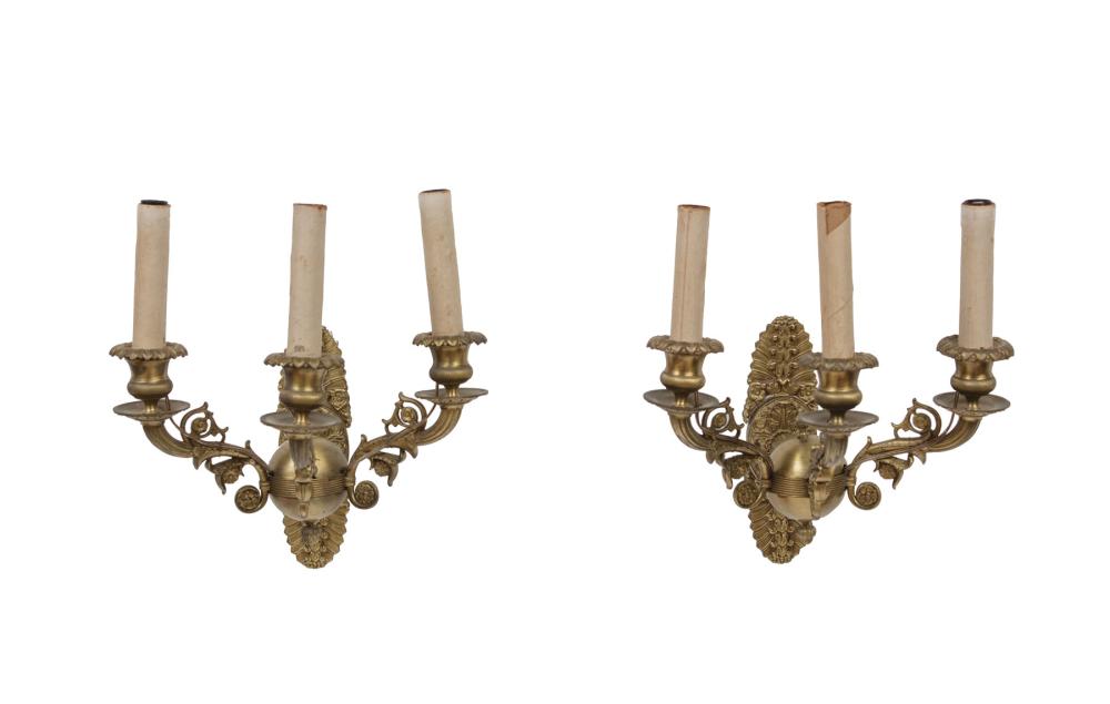 Appraisal: Pair of Empire-Style Bronze Three-Light Wall Sconces scroll arms electrified