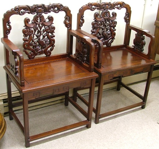 Appraisal: PAIR OF MING-STYLE ROSEWOOD ARMCHAIRS Chinese th century with matching