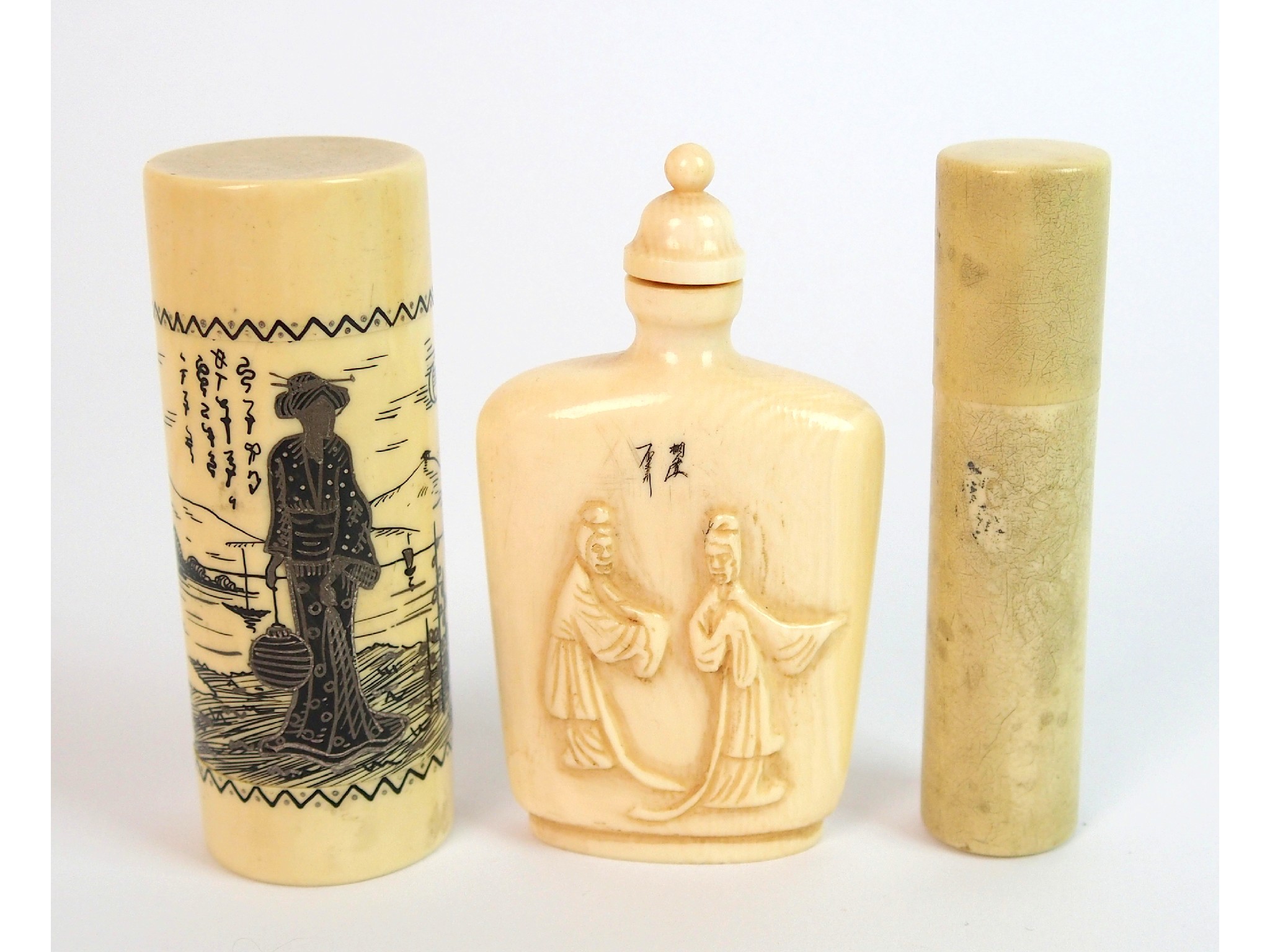 Appraisal: A Chinese ivory snuff bottlecarved with two figures and engraved