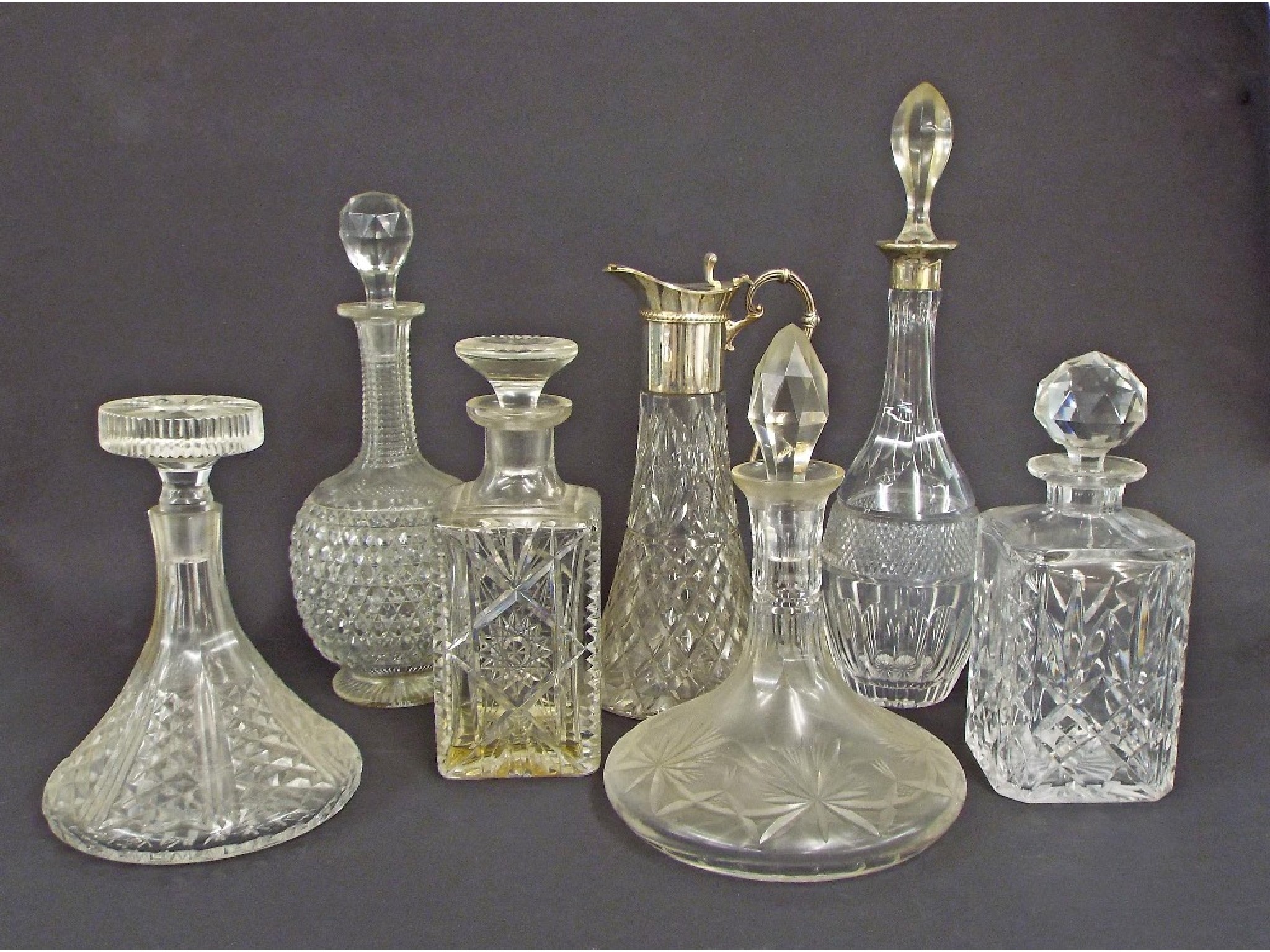 Appraisal: Collection of six glass decanters to include a hobnail cut