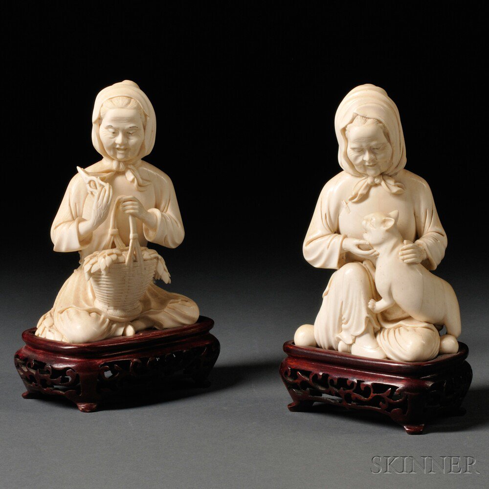 Appraisal: Pair of Figures of Old Women China one holding scissors