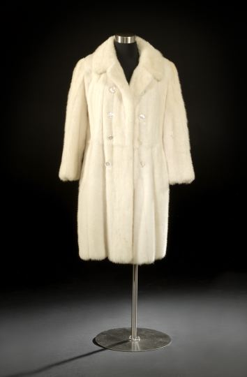 Appraisal: White Mink Coat of double-breasted style with large pearl-shell buttons