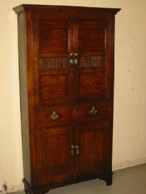 Appraisal: AN OAK FOOD CUPBOARD of Shropshire type with chamfered cornice