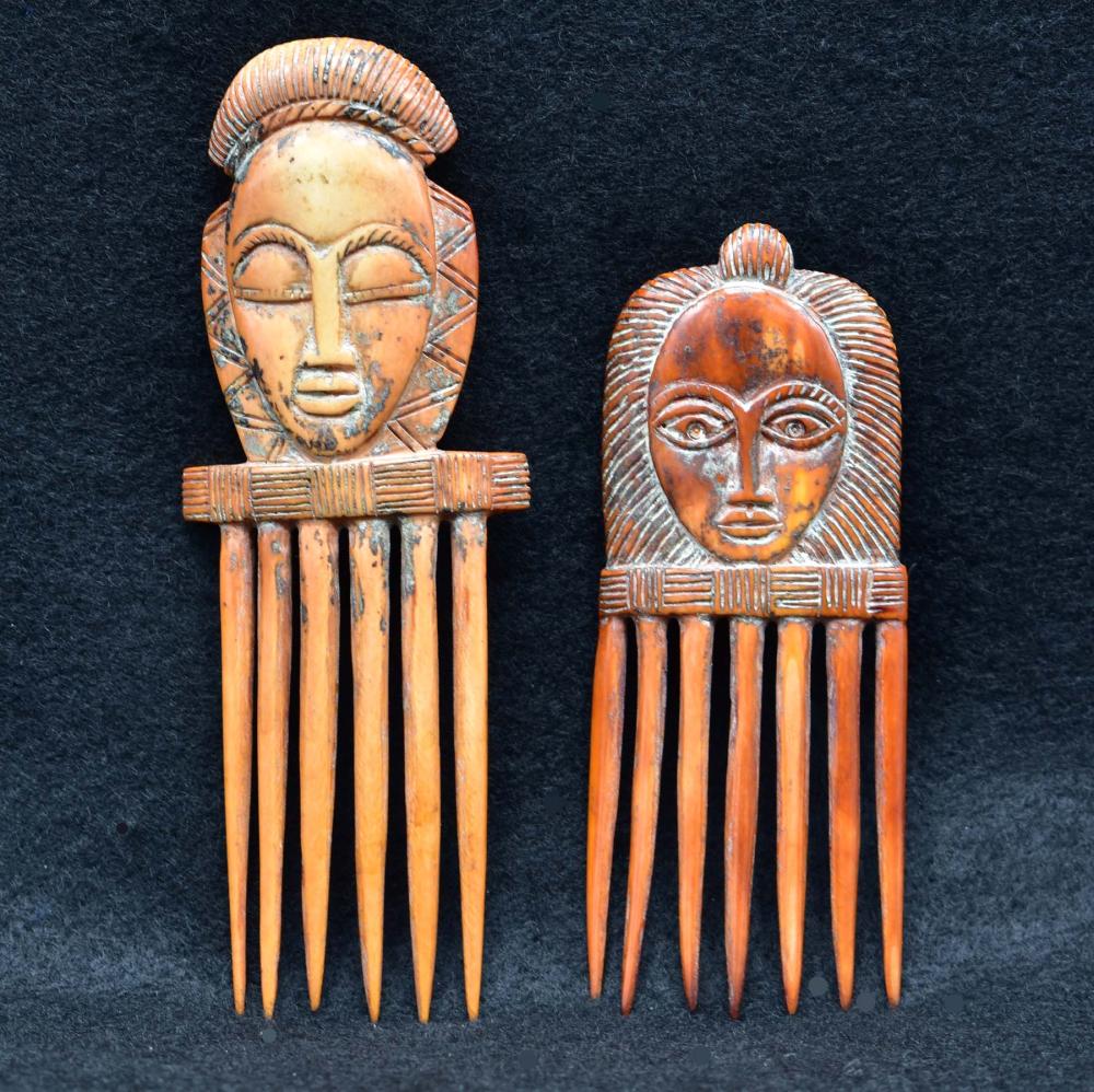 Appraisal: TWO AFRICAN STAINED HAIR COMBSBoth carved with faces and stained