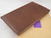 Appraisal: An Asprey tan leather clip board folder as new in