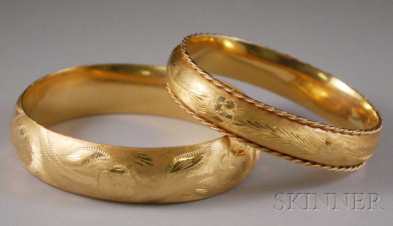 Appraisal: Two kt Gold Engraved Bangle Bracelets Rine total dwt interior