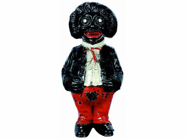 Appraisal: Cast Iron Golliwog Still Bank Description Made by John Harper