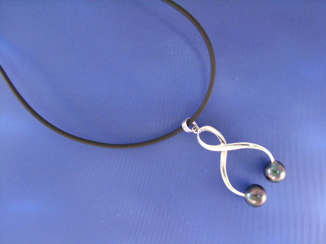 Appraisal: A silver pendant with two - mm Tahitian pearls on