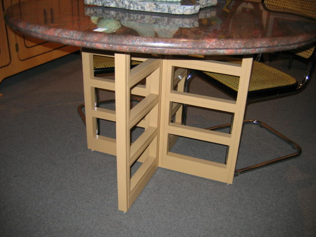 Appraisal: CUSTOM MADE GRANITE TABLE with red circular top supported by