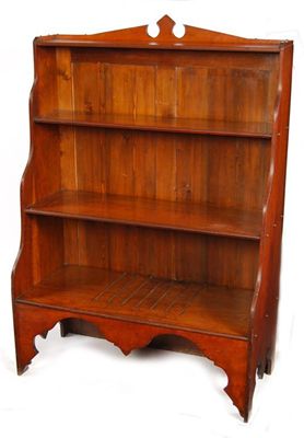 Appraisal: A Victorian walnut waterfall bookcase the lower tier previously with