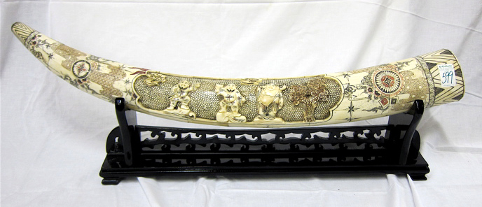 Appraisal: CHINESE RELIEF CARVED AND VENEERED BONE TUSK one side centering