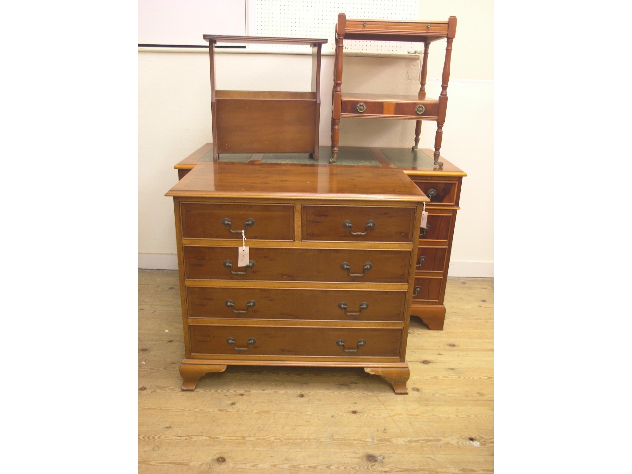 Appraisal: A reproduction yew-veneered chest two short and three long drawers