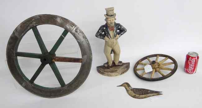 Appraisal: Lot including contemporary Uncle Sam doorstop two wheels and sheet