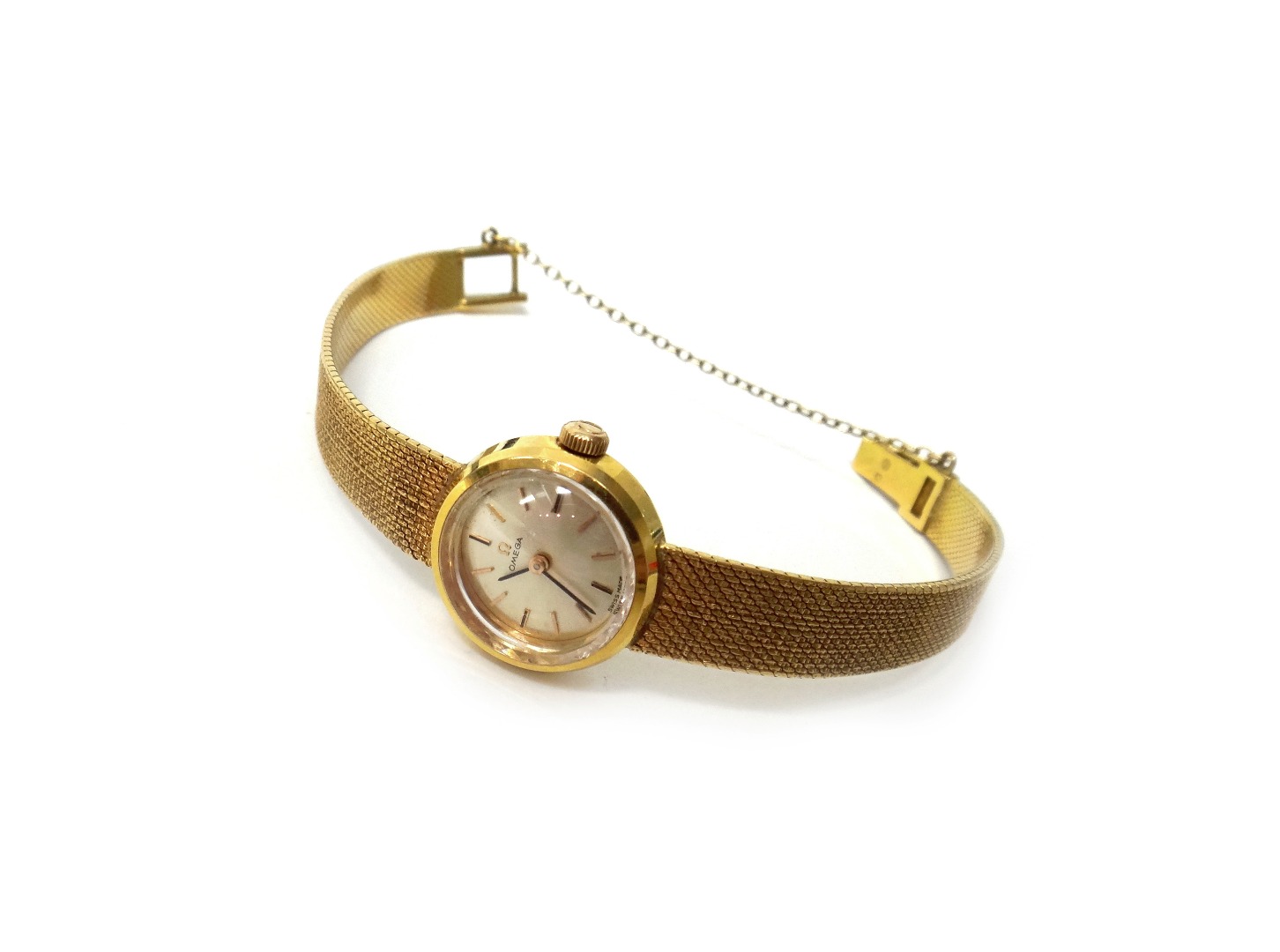 Appraisal: A lady's gold Omega bracelet wristwatch the signed circular silvered