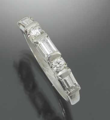 Appraisal: A Ladies' Platinum and Diamond Band Platinum band set across