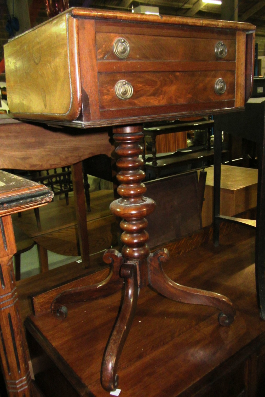 Appraisal: A th century mahogany drop flap work table with turned