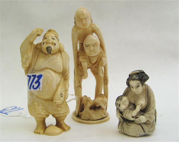 Appraisal: THREE ASIAN CARVED IVORY FIGURES a Japanese netsuke in the