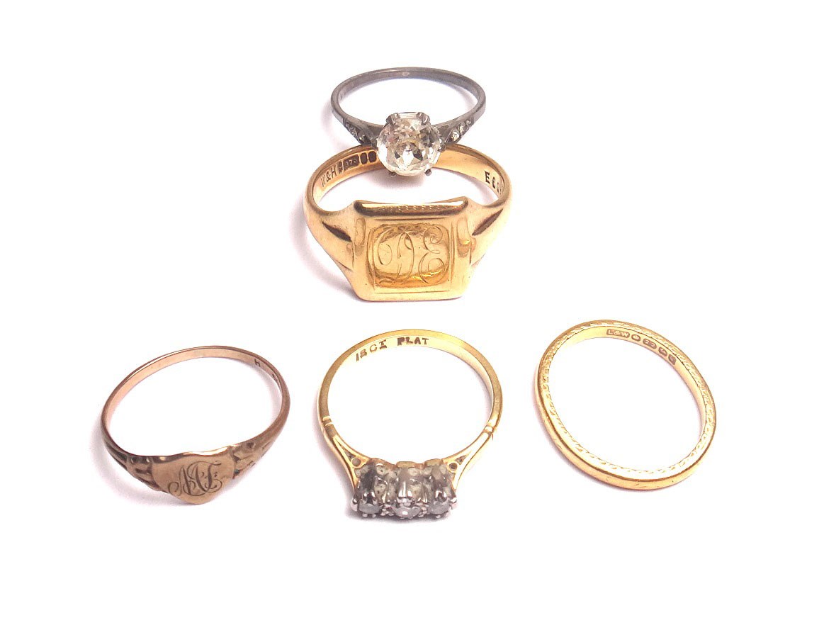 Appraisal: A gold and platinum diamond set three stone ring mounted