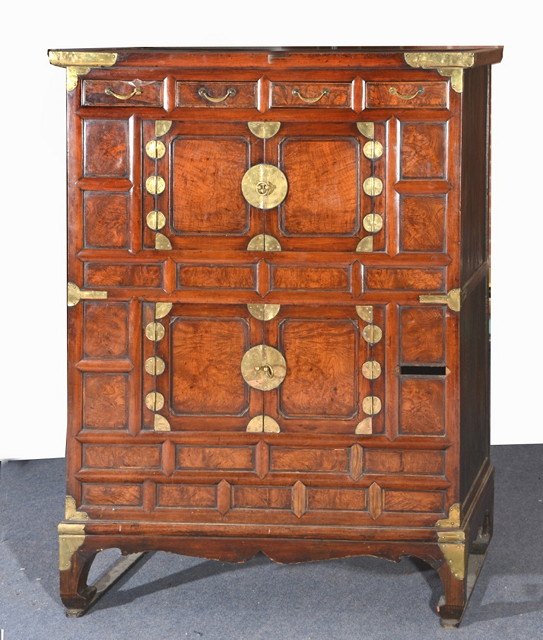 Appraisal: A KOREAN ELM CHEST fitted two central cupboards and four