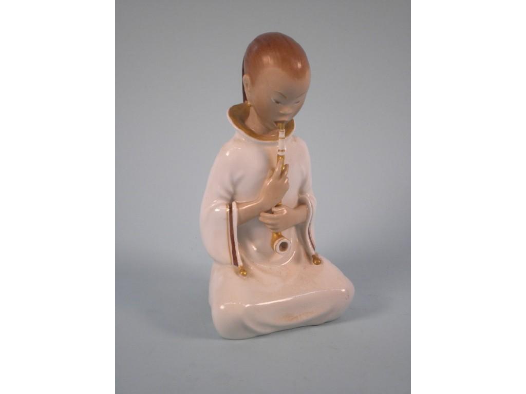 Appraisal: A Royal Copenhagen white and gold porcelain figure of an