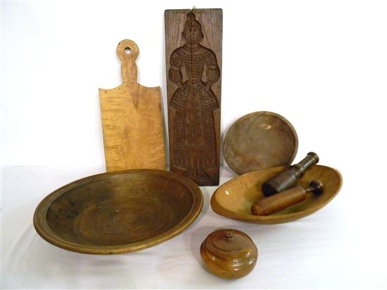 Appraisal: Three wooden treen bowls two wooden mashers one with checking