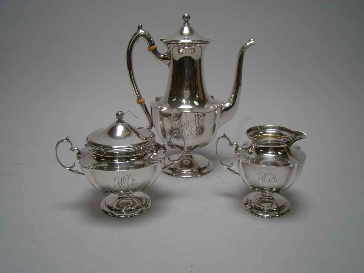 Appraisal: THREE-PIECE STERLING SILVER DEMITASSE COFFEE SET In a Chippendale-style variant