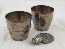 Appraisal: A pair of silver on copper plated beakers with cap