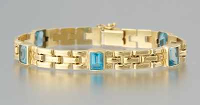 Appraisal: A Ladies' Blue Topaz and Gold Bracelet k yellow gold