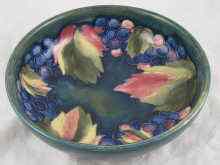 Appraisal: A Moorcroft bowl leaf and berry pattern tube lined on