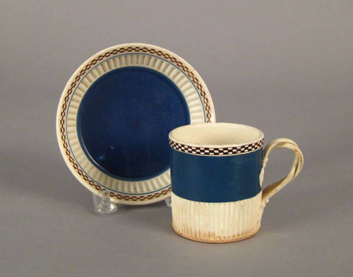 Appraisal: Mocha cup and saucer with blue ground and checkerboard rim