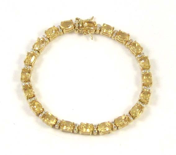 Appraisal: CITRINE AND DIAMOND BRACELET - inches in length with oval-cut