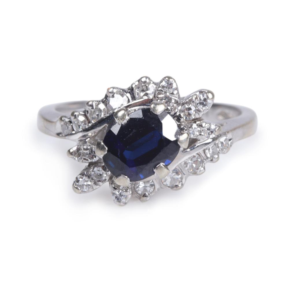 Appraisal: White gold K sapphire and diamond estate ring containing an