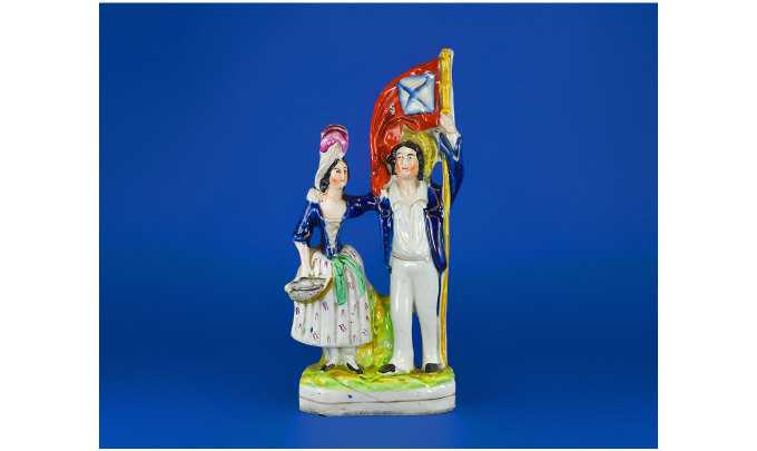 Appraisal: th Century Staffordshire Figure Group Man and woman with the