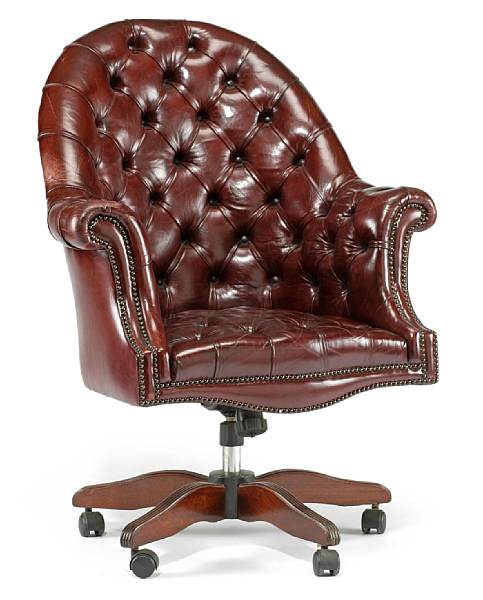 Appraisal: A Victorian style tufted burgundy leather desk chair The arched