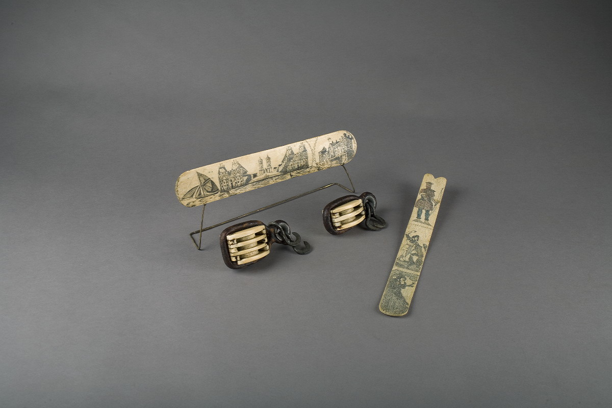 Appraisal: TWO WHALE IVORY LEATHER-BOUND BLOCKS The double and triple thimbles