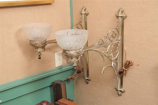 Appraisal: PAIR OF WALL SCONCES Brass having pierced foliate features and