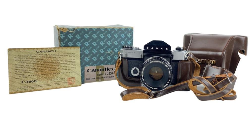 Appraisal: Vintage Cannon R Camera w Box CaseIncludes Super-Cannomatic Lens Appears