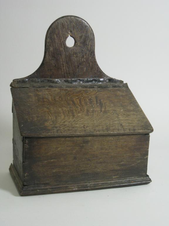 Appraisal: An antique oak Salt Box with hinged sloping lid in